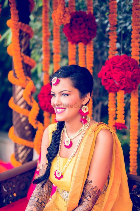 Floral jewellery on bride on Mehendi