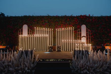 Unique stage decor with vertical lights and pampas grass