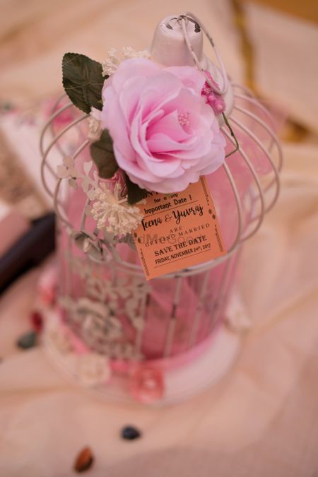Save the date idea with favours in birdcage 