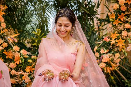 Photo of Bride wearing a pastel pink sharara set on her Haldi.