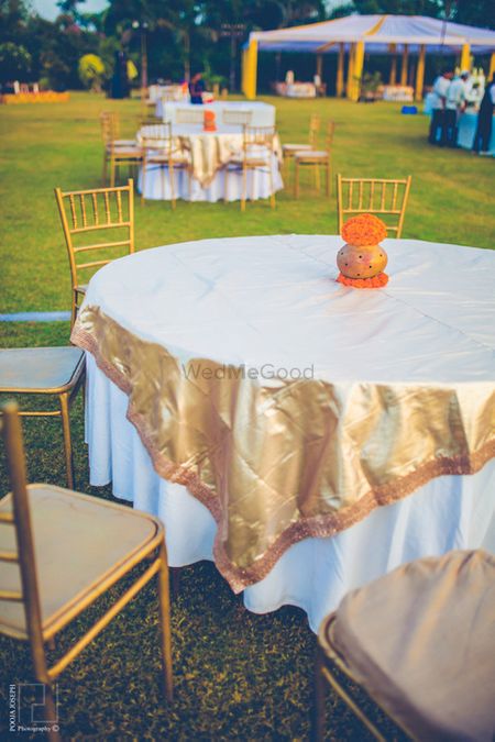 gold foil metallic table centerpiece with gold chairs