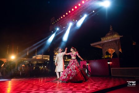 Photo of Couple dancing on stage after the wedding