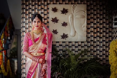 south Indian bride in a pink & gold kanjeevaram