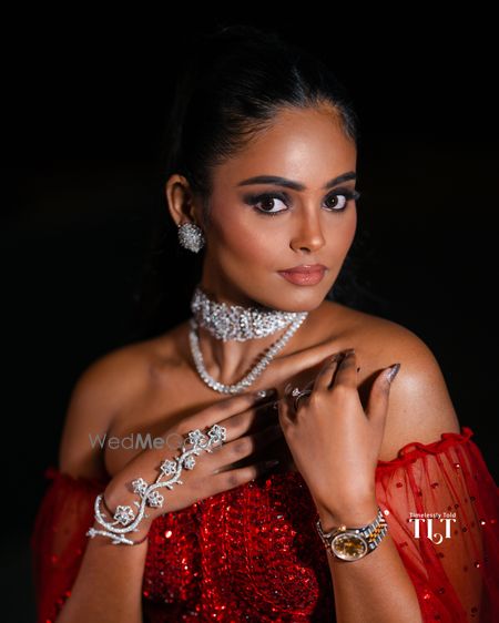 Unique diamond jewellery with layered necklaces and a floral haathphool for the reception night 