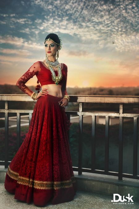 Photo of deep jewel toned rich red all over threadwork bridal lehenga in one color
