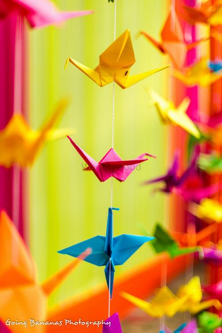 paper origami cranes made to provide a backdrop of the vedi