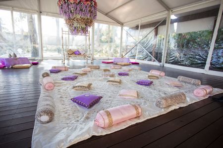 A sit-down Mehendi setup for guests.
