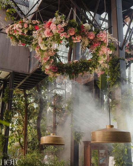 Photo of Gorgeous floral and hanging chandelier with white and pink florals