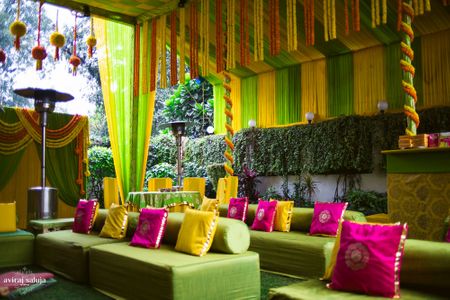 Colorful Mehendi decor in pink and yellow