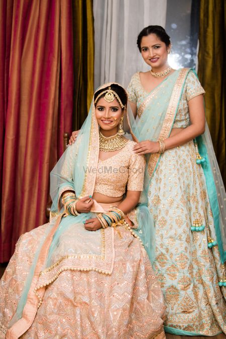 Bride and sister both in pastels