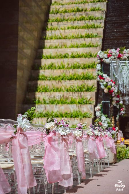 Photo of light pink chair decor theme with florals