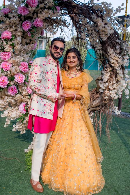 Bride and groom mehendi outfit with ruffled blouse