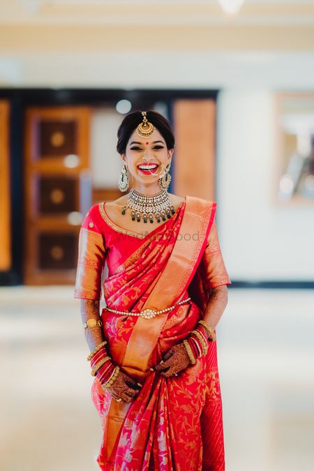 A bride in red kanjeevaram on her wedding day 