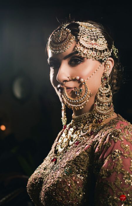 A close-up shot of bride in vintage jewels 