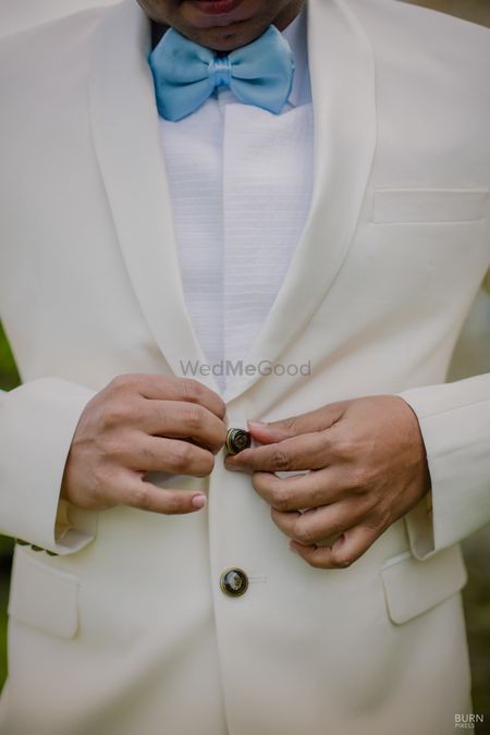 Photo of Groomwear idea with light blue bow tie with suit