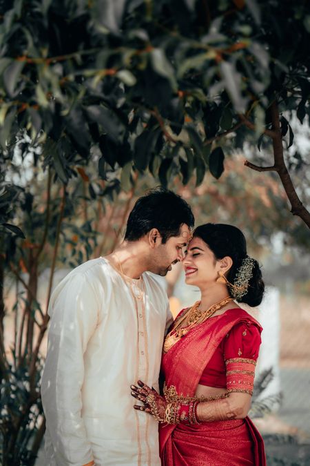 cute south indian couple shot with bride in red saree