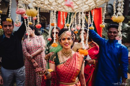 Photo of South indian bridal entry shot under chadar