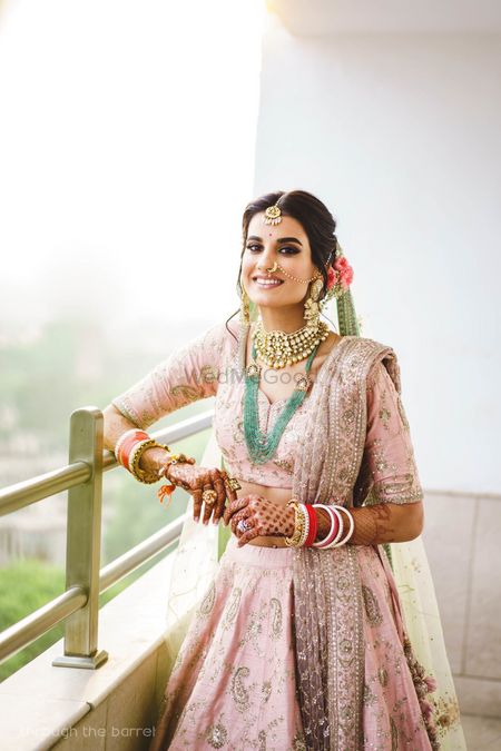 Photo of Happy pastel bride contrasting jewellery