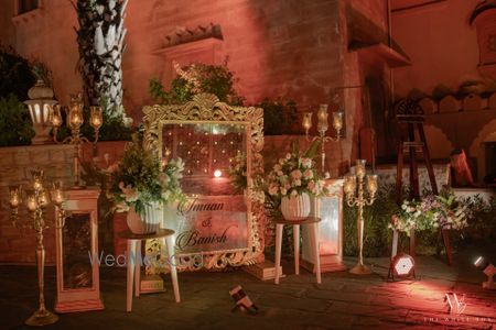 Photo of Lovely floral entrance decor with a personalised mirror with couple names