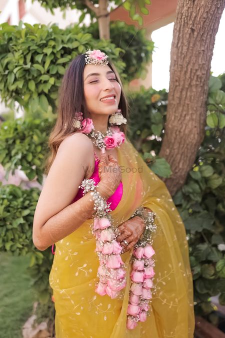 Minimal yet elegant haldi bridal look with floral jewellery