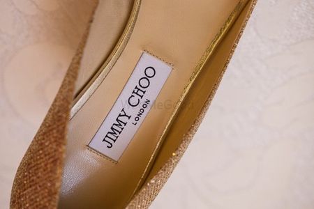 Photo of Jimmy choo gold shoes