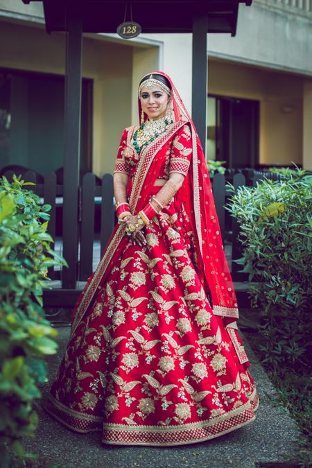 Gorgeous bride in a beautiful red lehenga.