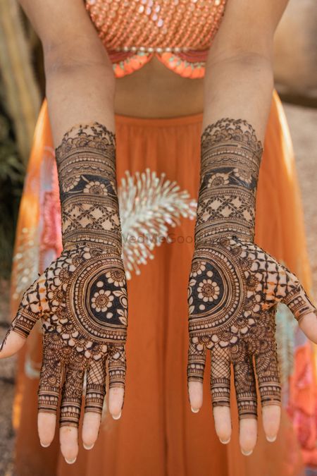 Photo of half and half modern mandala mehendi design for bride