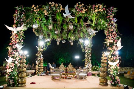 Photo of grand mandap decor with lots of unique elements and florals