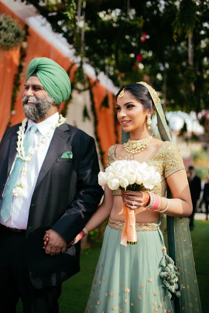 Photo of Bride entering wedding with her father