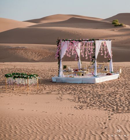 Photo of Gorgeous yet minimal mandap in the middle of a desert