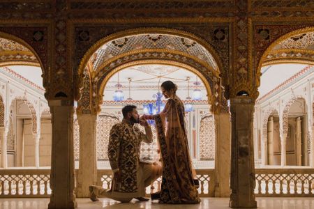 Pre wedding shoot idea with proposal shot in palace