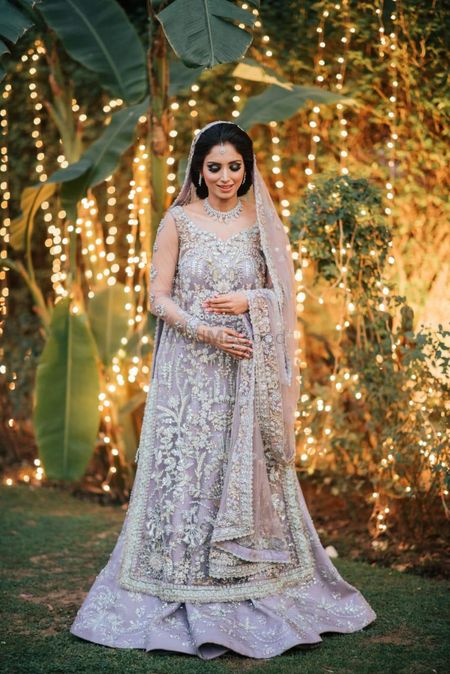 Bride dressed in a grey lehenga for her reception.