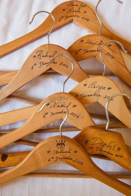 Photo of customised hangers for each bridesmaid on their getting ready session