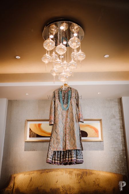 unique sherwani on a hanger in grooms room