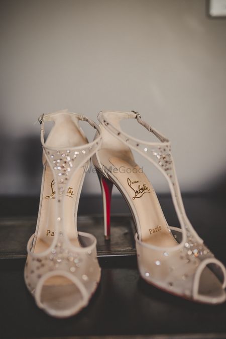 Photo of Louboutin bridal heels in white and gold