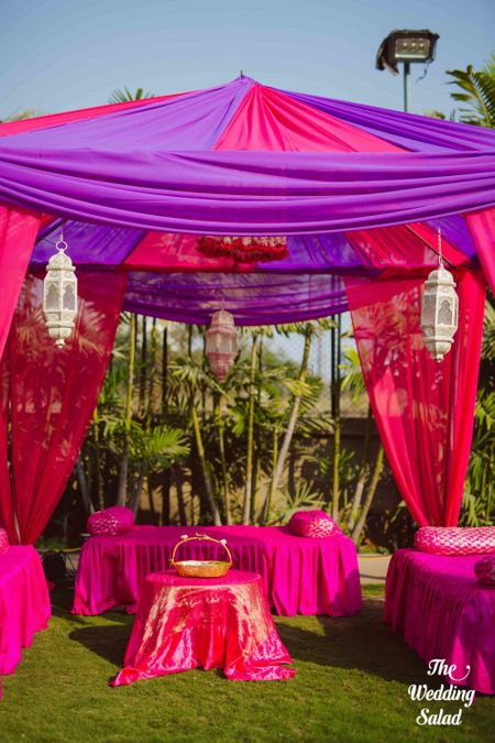 Mehendi decor idea with pink and purple tents and theme 