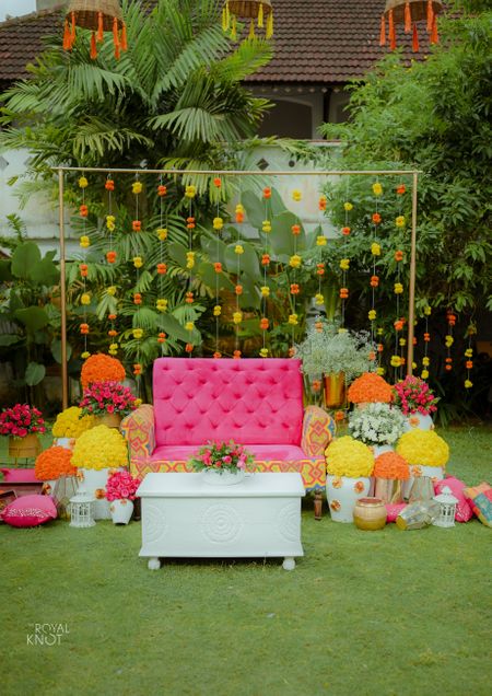 Photo of cute mehendi backdrop with colourful elements for home decor