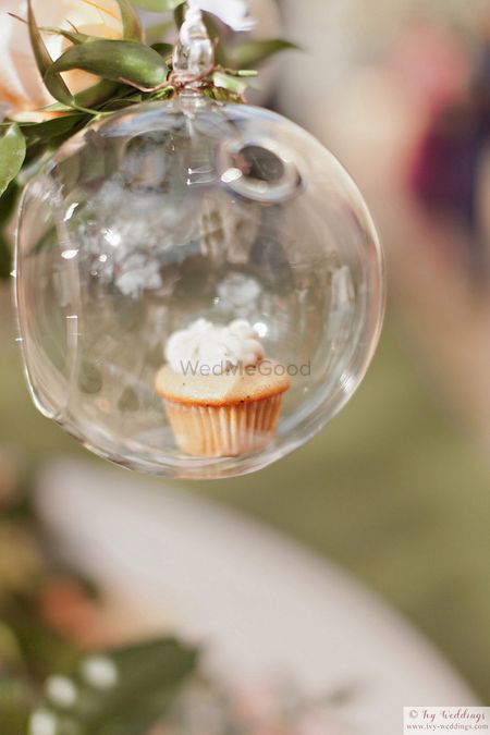 Photo of Cupcake in glass orb decor idea for wedding