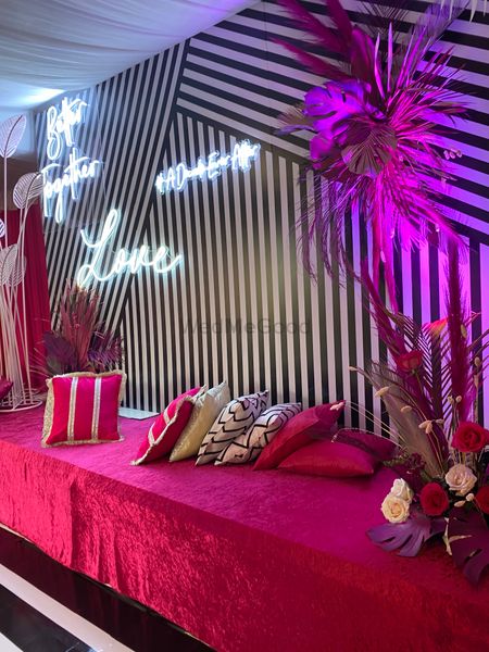 pink white and black sangeet decor idea with neon lights