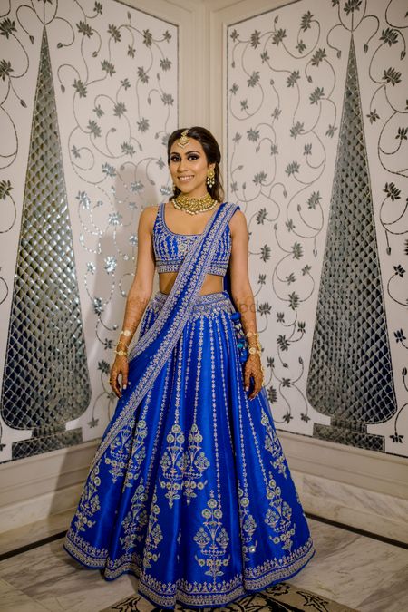 Bride wearing an electric blue lehenga on her Sangeet.