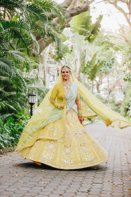 Offbeat bridal lehenga in yellow and mint colours