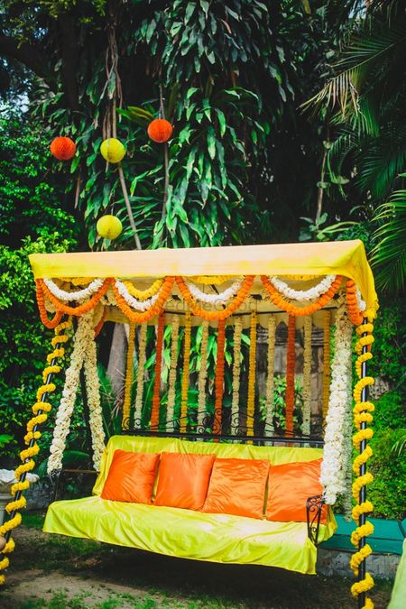 Photo of Floral swing with cushions for mehendi