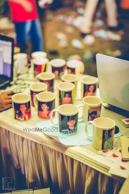 Have a photographer give instantly printed photos on mugs as wedding favors