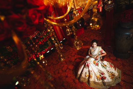 Top shot of bride in floral sabya lehenga 