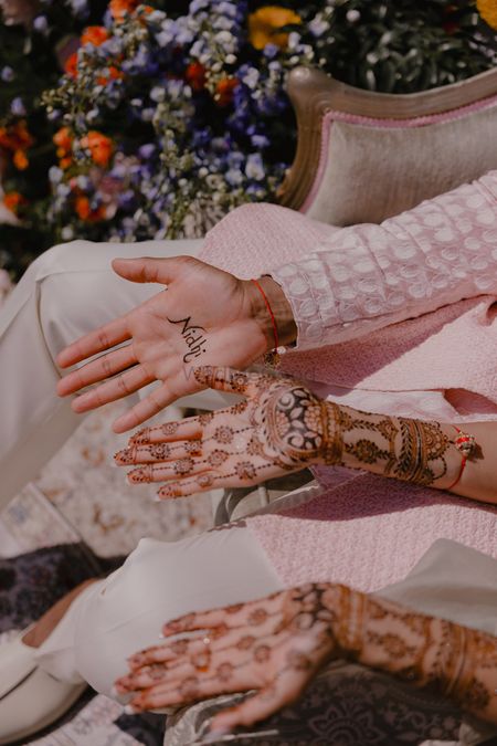 Photo of Bride and groom minimalistic mehendi design portrait