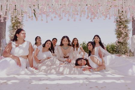This unique bride and bridesmaid shot in an all-white theme