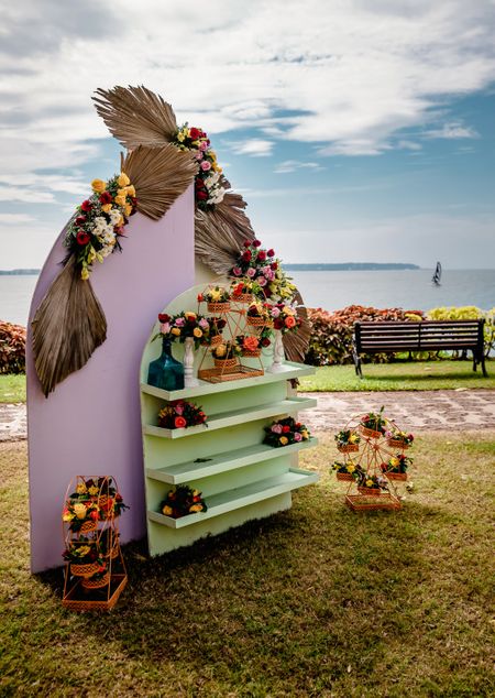 Unique floral décor elements at the entrance for a beach wedding