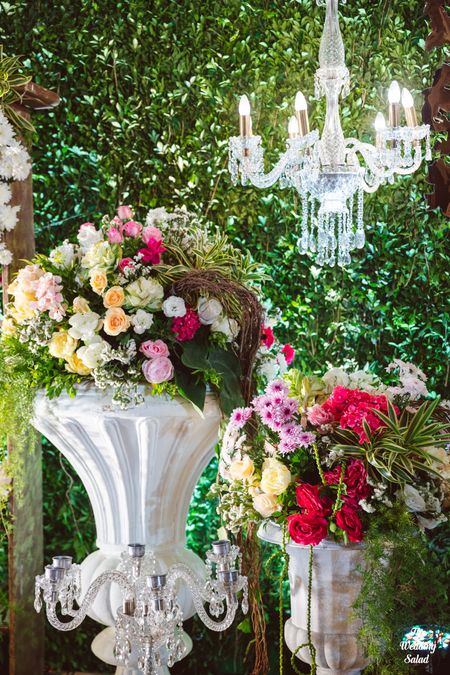 Photo of floral decor idea for wedding with hanging chandelier