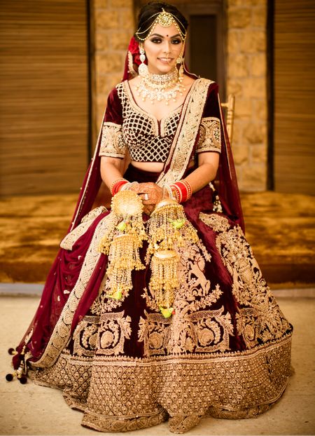 Photo of Winter wedding velvet maroon lehenga