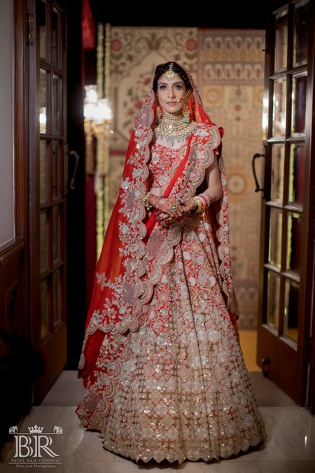 Bride in a red Anamika Khanna Lehenga